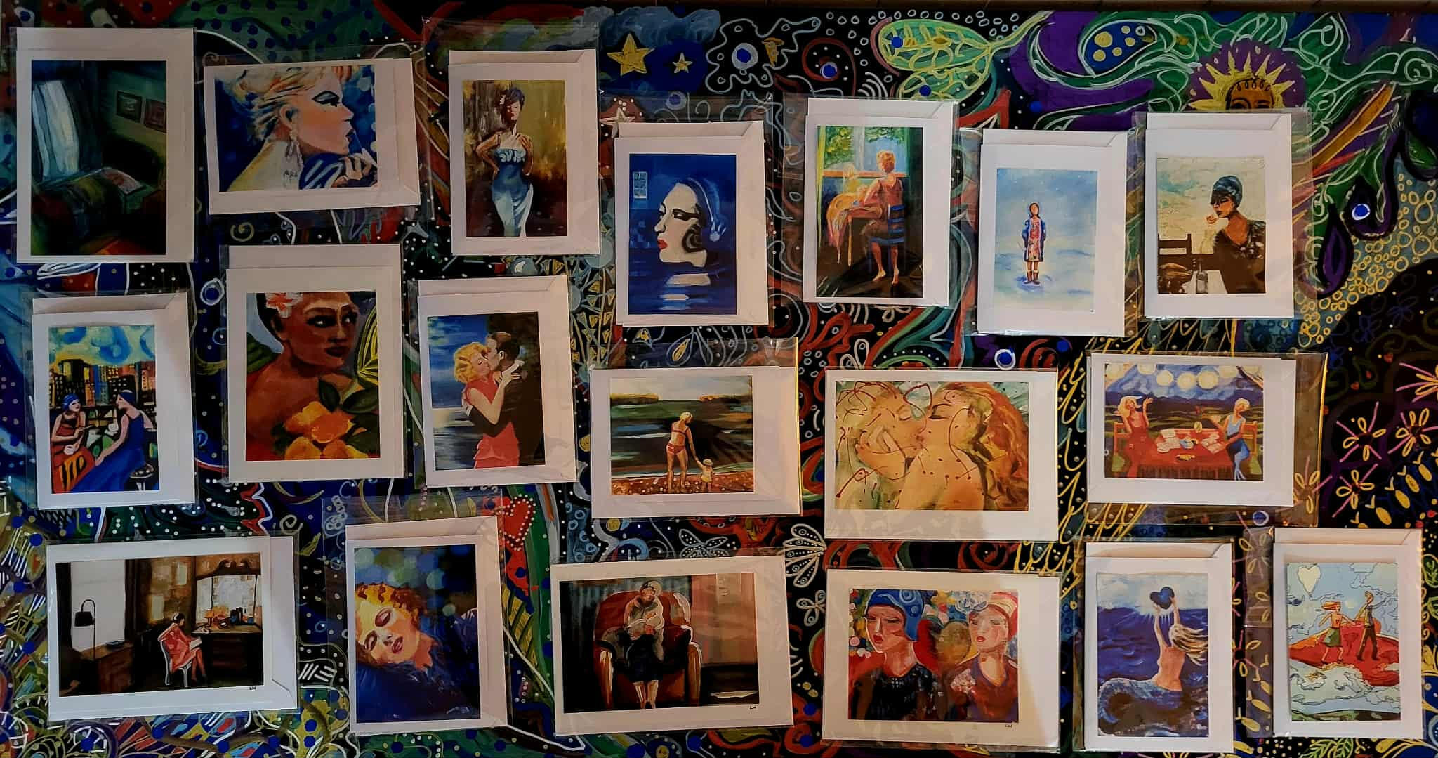 photo by Lucie Walker photof of a ceramic crow, a ceramic plate of gemstones, a lit salt lamp, a fern, some hanging ornaments in a window